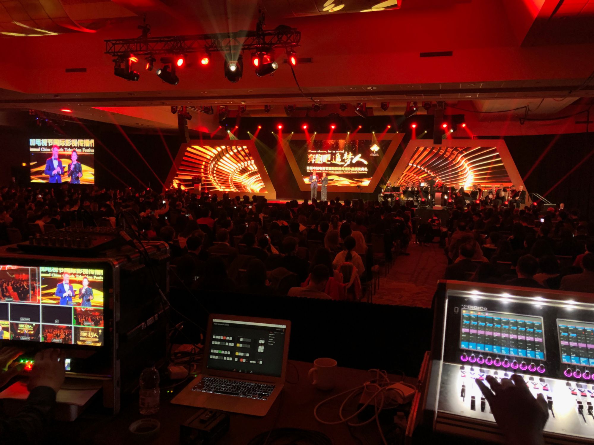 Award ceremony stage with three LED screens, orchestra and full house, Toronto ballroom