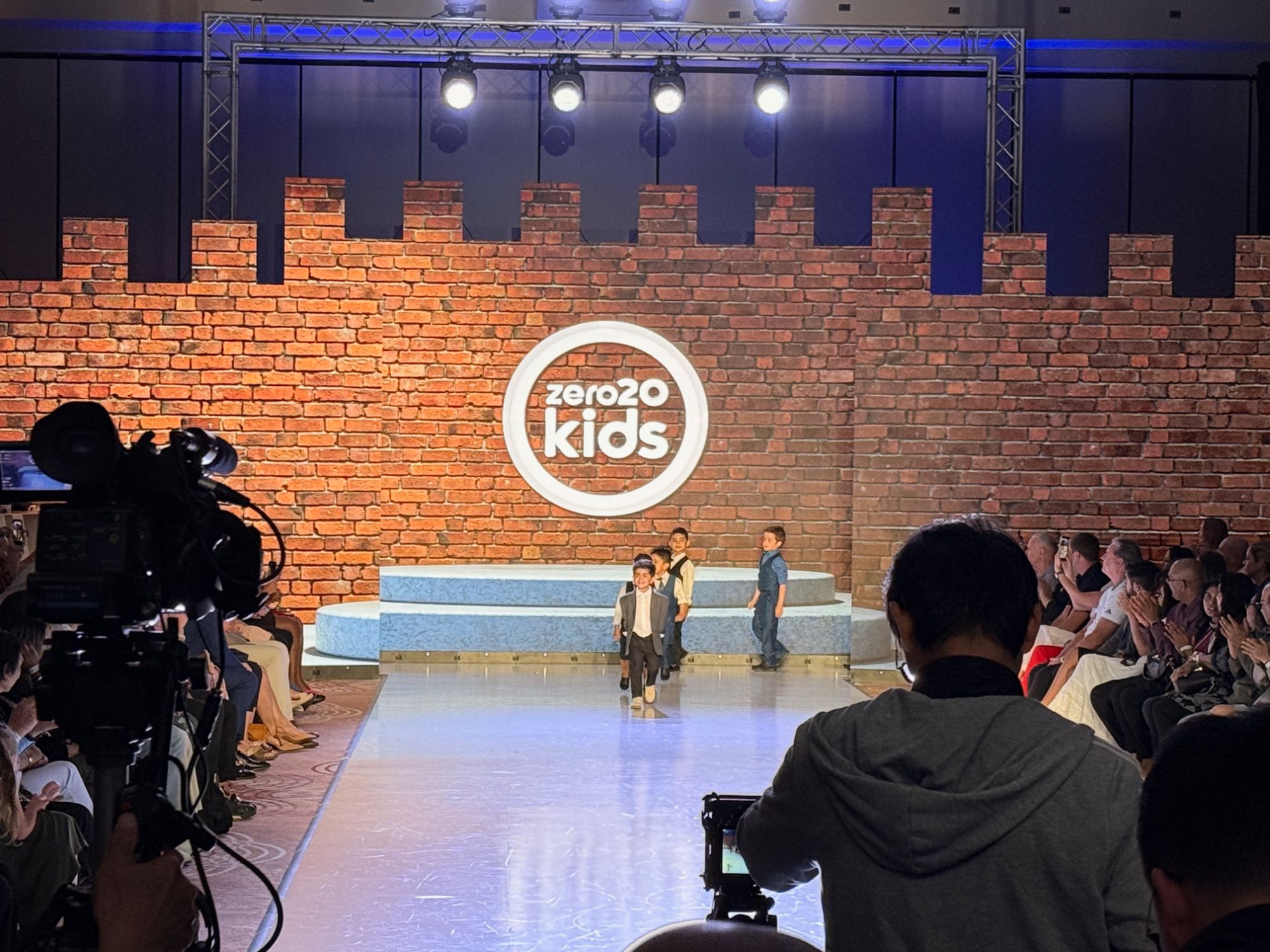 Runway with brick courtyard scenery mapped across the LED backdrop